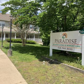 A view of the Paradise establishment, surrounded by greenery.