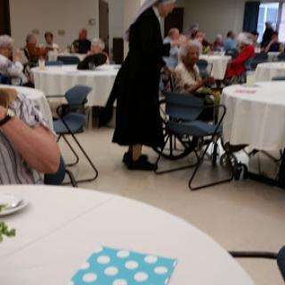 A lively community gathering with seniors enjoying their time together.