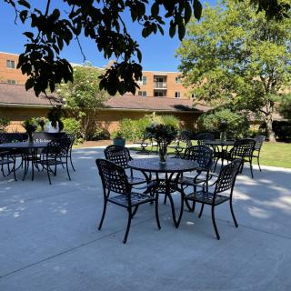 Outdoor seating area in a courtyard on a sunny day.