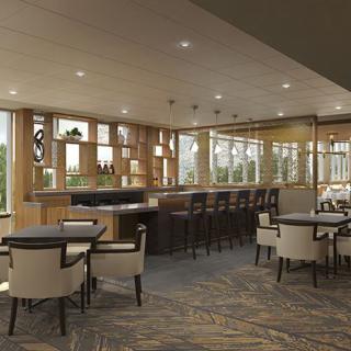 A modern restaurant bar with stylish seating and elegant interior design.