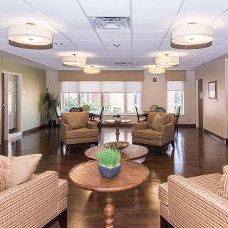 A modern lounge area with comfortable seating and warm lighting.