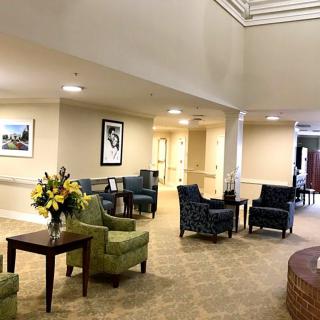 A well-lit lobby area with comfortable seating and decorative elements.