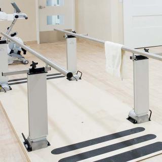 A set of parallel bars used in physical rehabilitation and therapy.