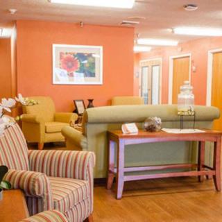 A cozy waiting room with comfortable seating and warm decor.