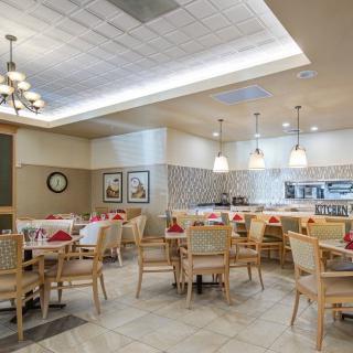 A cozy restaurant dining area with neatly arranged tables and chairs.