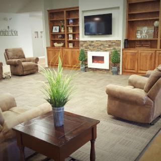 A cozy living room setup featuring comfortable recliners and a warm, inviting ambiance.