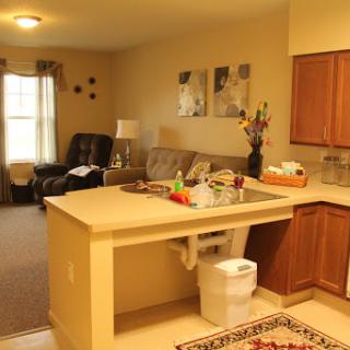 A cozy open-concept living space showcasing a kitchen and living room combination.
