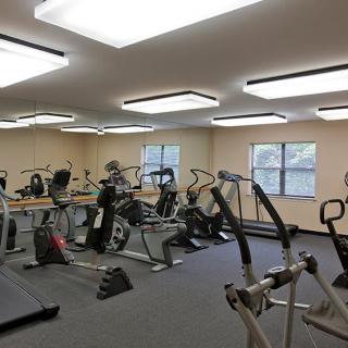 A well-equipped gym with various exercise machines and equipment.