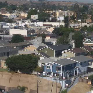 A view of a residential area showcasing various houses in an urban setting.