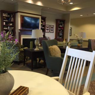 A cozy lounge area with comfortable seating and elegant decor.