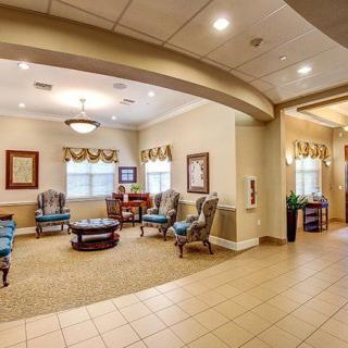 A well-lit lobby area with comfortable seating and elegant decor.