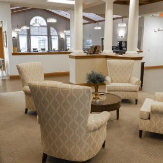 A cozy lobby with elegant seating and classic architectural elements.