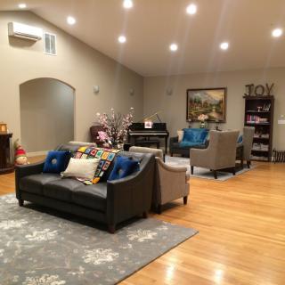 A cozy living room with modern furnishings and warm lighting.