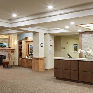 A modern reception area with a welcoming desk and comfortable waiting space.