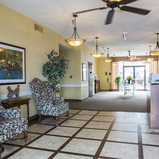 A spacious lobby area with seating and elegant decor.