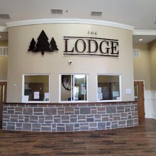 The welcoming reception area of a lodge with a rustic design.