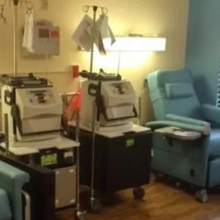 A healthcare setting with medical equipment and chairs.