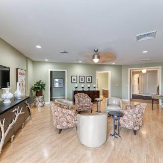 A modern living room with stylish furniture and wooden flooring.
