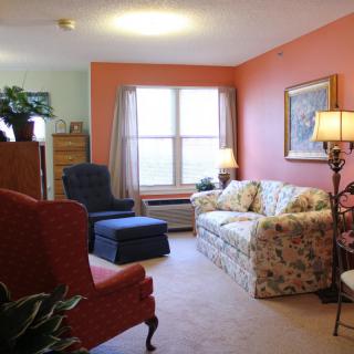 Cozy living room with colorful walls and comfortable seating.