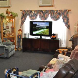 A cozy living room with comfortable seating and a television.