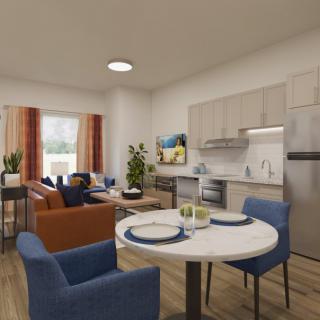 A modern open-plan apartment featuring a kitchen, dining area, and cozy living room.