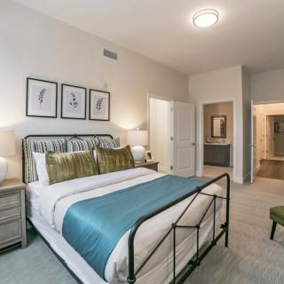 A modern bedroom with stylish decor and comfortable furnishings.