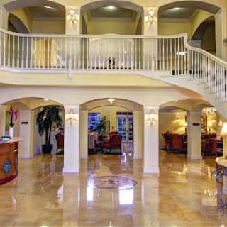 Luxurious hotel lobby with marble flooring and elegant decor.