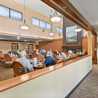 A spacious dining area filled with people enjoying a meal together.