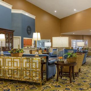 A well-decorated lobby with comfortable seating and warm lighting.