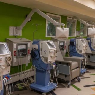 A row of dialysis machines in a medical facility.