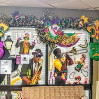 A vibrant display capturing the essence of jazz and Mardi Gras with musicians and festive decorations.