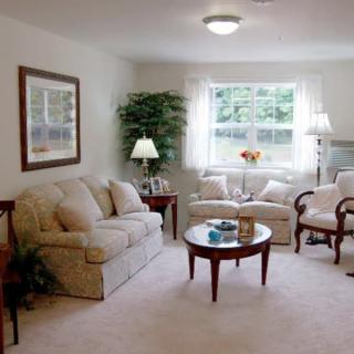 A cozy living room with comfortable seating and natural light.
