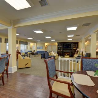 Comfortable communal living area with seating and tables.