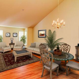 A cozy living and dining area with elegant furniture and decor.