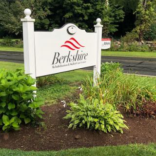 Welcome sign for Berkshire surrounded by lush greenery.