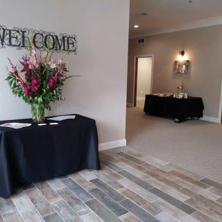A welcoming reception area decorated with a floral arrangement on a table.