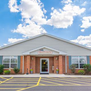 A modern building with a welcoming entrance under a blue sky.
