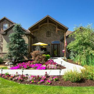 Beautiful house with a landscaped garden and vibrant flowers.
