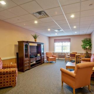 A cozy living room with comfortable seating and a television.