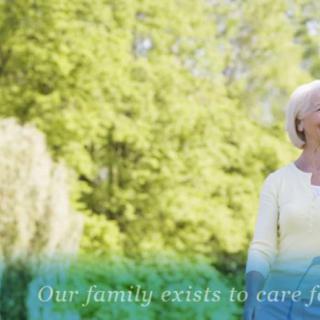 An elderly woman enjoys a peaceful moment in nature, embodying care and serenity.