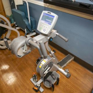 A stationary exercise bike with a digital display, designed for indoor fitness and cardio workouts.