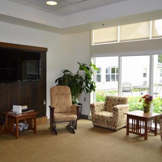 A cozy living room with comfortable seating and natural lighting.