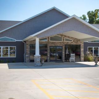 A commercial building with a prominent entrance and an awning.