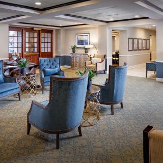 A cozy and elegant lounge area with comfortable seating and tasteful decor.