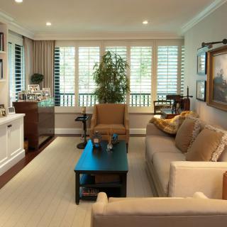 A cozy, well-furnished living room with a sofa and coffee table.