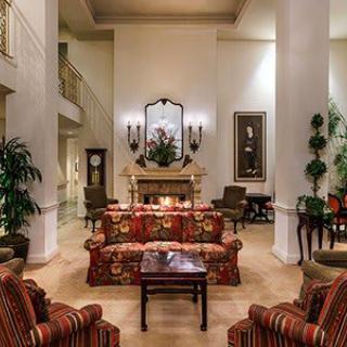 Elegant hotel lobby with luxurious furniture and decor.