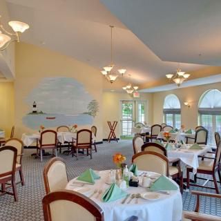 Elegant dining area with neatly arranged tables and ambient lighting.