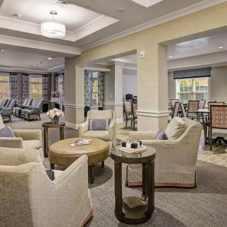A modern and cozy living room with comfortable seating and elegant decor.