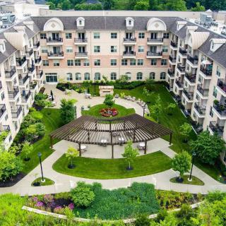 Aerial view of a residential building with a landscaped courtyard.