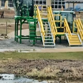 A vibrant playground featuring slides and stairs for children's outdoor play.